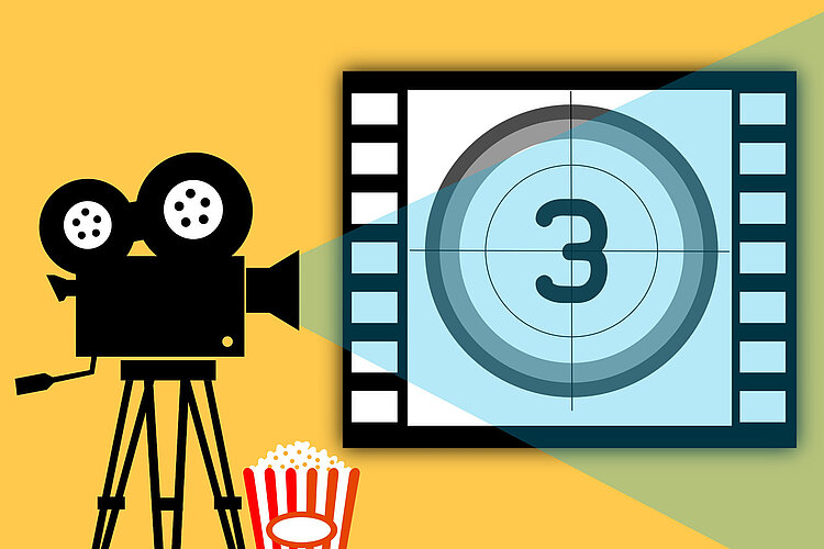 Abbildung eines alten Filmprojektors auf gelbem Hintergrund, der auf eine Leinwand in Schwarzweiß den Countdown 3 projiziert. Unter dem Projektor steht ein Popcornbehälter.