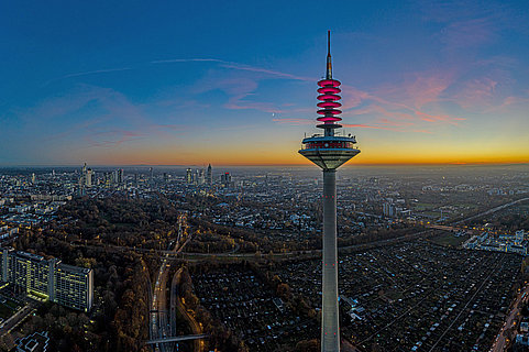 Drone image of the Frankfurt skyline with television tower in the evening during a colorful and impressive sunset