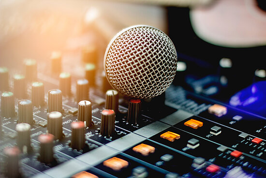 Microphone in room with recording device.